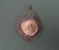A Victorian gold sovereign dated 1891 in a 9ct gold slip mount with arched wirework decoration,