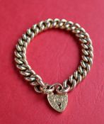 A 9ct yellow gold bracelet with interlaced oval links to a padlock clasp, approximately 21.