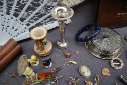 A 9ct gold dolphin brooch approximately 1 gram, together with a 14k yellow metal ring,