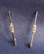 A three stone diamond bar brooch,