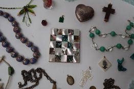 A mother of pearl and abalone shell powder compact together with beaded necklaces,