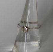 A solitaire diamond ring, the round old cut diamond approximately 0.