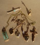 A 9ct yellow gold crucifix, together with a 9ct gold Peter Pan pendant, 9ct gold necklaces,