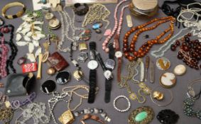 An amber bead necklace together with assorted costume jewellery including beaded necklaces,