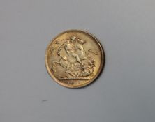 A George V gold sovereign,