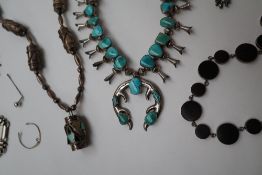 A Sterling silver and hardwood necklace together with a collection of silver necklaces,