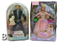 Two Boxed Barbie Dolls
