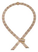 A 9ct three coloured yellow gold textured brick link necklace