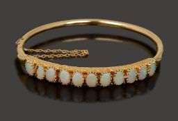 An opal hinged bangle