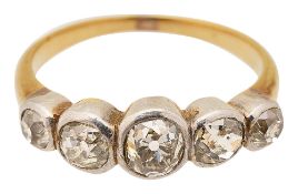 A diamond five stone ring