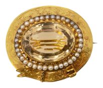 A mid Victorian citrine and half pearl brooch