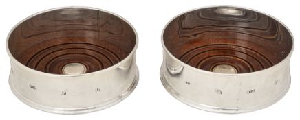 A pair of modern silver bottle coasters