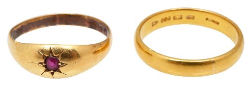 A 18ct garnet ring and a 22ct gold wedding band