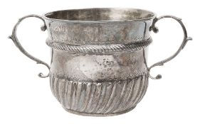 A Queen Anne Britannia silver twin handled porringer