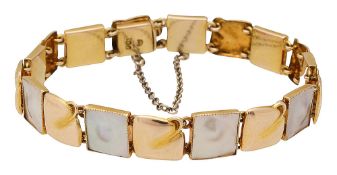 A Murrle Bennett 9ct gold and mother of pearl Arts and Craft bracelet