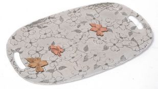 A Wendell August Forge twin handled mixed metal Dogwood tray
