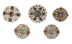 An Arts and Crafts cased set of five silver and paste brooches
