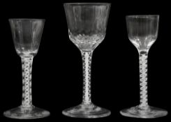 Three mid 18th century opaque twist stemmed wine glasses