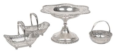 A pair of George V swing handled bonbon baskets, a pedestal dish etc.