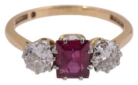 A ruby and diamond three stone ring