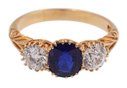 A sapphire and diamond three stone ring