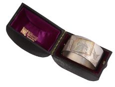 A late Victorian Aesthetic Movement cased silver hinge bangle