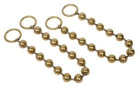 A pair of Victorian brass bead curtain tie backs