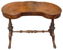 A Victorian walnut kidney shaped dressing table
