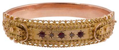 A 9ct gold Victorian garnet and diamond set bangle