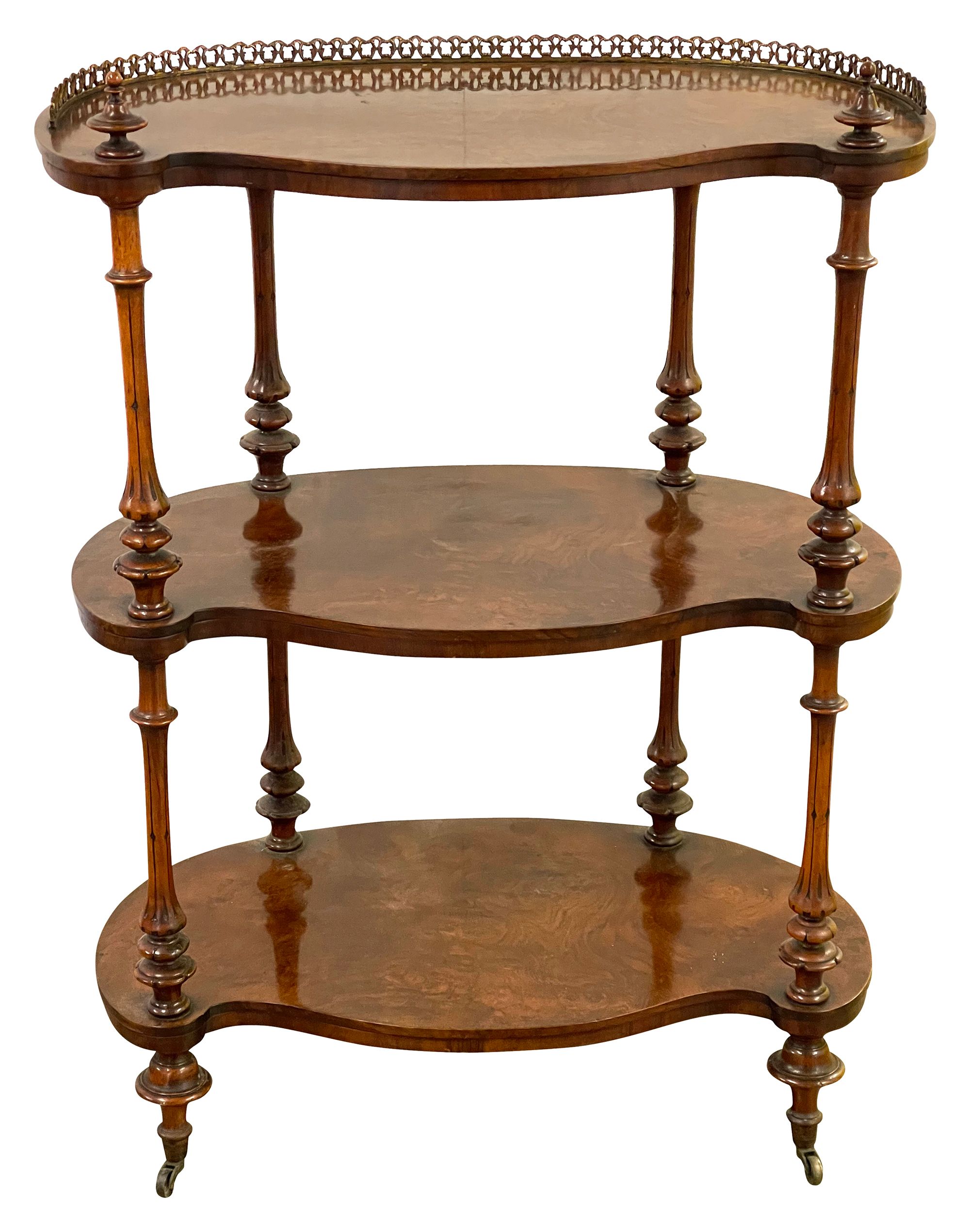 A Victorian figured walnut three tier etagere