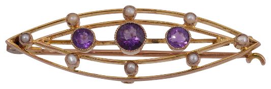An Edwardian 9ct graduated amethyst and half pearl bar brooch