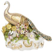 An early 20th century Sampson Hancock Derby figure of a peacock