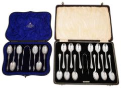 A set of six silver apostle coffee spoons and another set