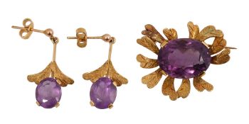 An amethyst brooch and a pair of ear pendants en suite