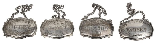 A set of four modern silver decanter labels