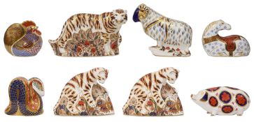 A collection of eight Royal Crown Derby paperweights