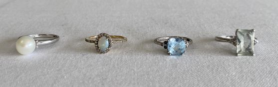 Four assorted rings: