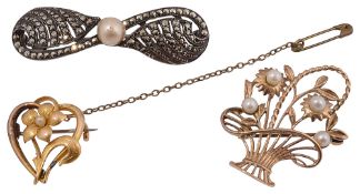 A group of three brooches