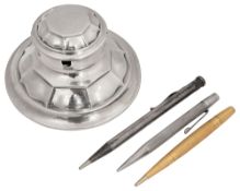 An Edwardian silver capstan inkwell and propelling pencils