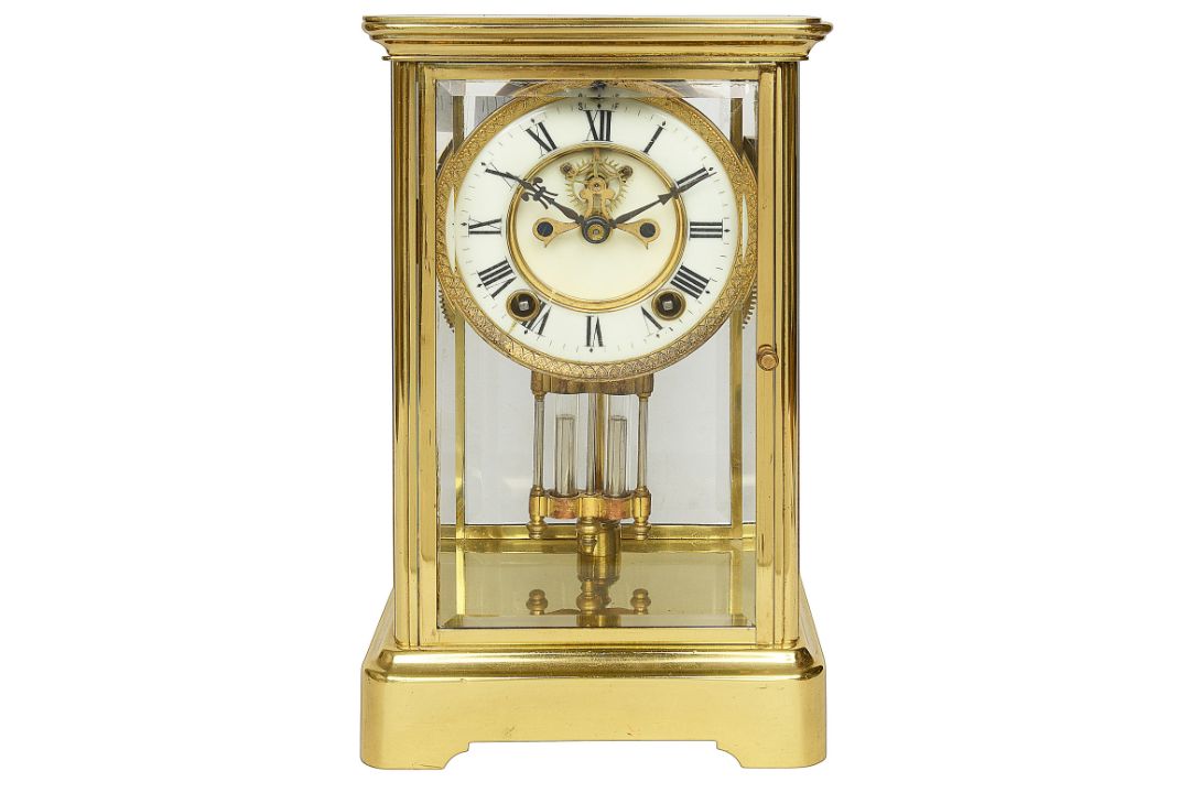 An early 20th century Ansonia lacquered brass four glass mantle clock