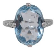 An aquamarine and diamond-set ring