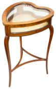 An Edwardian mahogany heart shaped bijouterie table