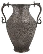 A late 19th century Indian Kashmiri chased silver twin handled vase