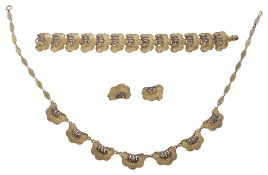 A silver, silver gilt and marcasite demi parure