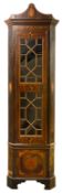 An Irish George III mahogany standing corner cupboard
