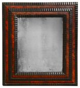 A Flemish tortoiseshell ripple moulded mirror