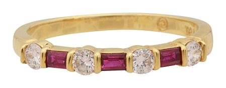 A diamond and ruby half hoop ring