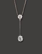 A diamond two stone pendant on chain