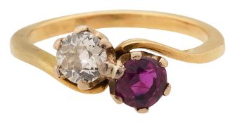 A ruby and diamond cross over ring