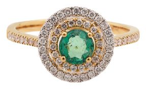 An emerald and diamond-set ring